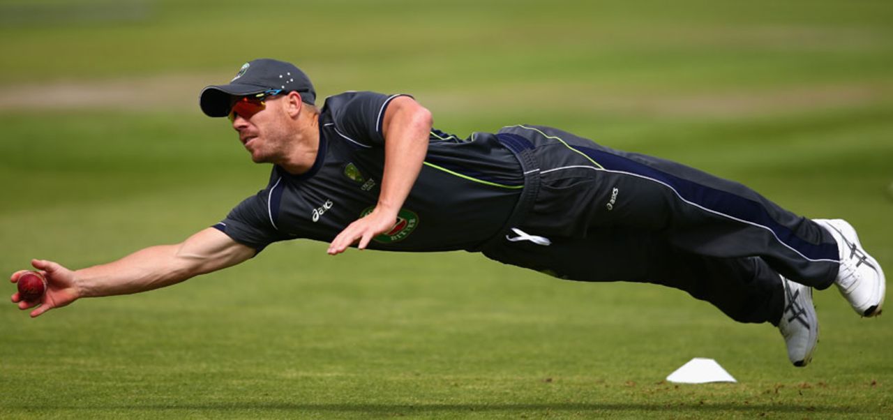 David Warner dives to take a catch during a practice session, Old Trafford, Manchester, July 30, 2013