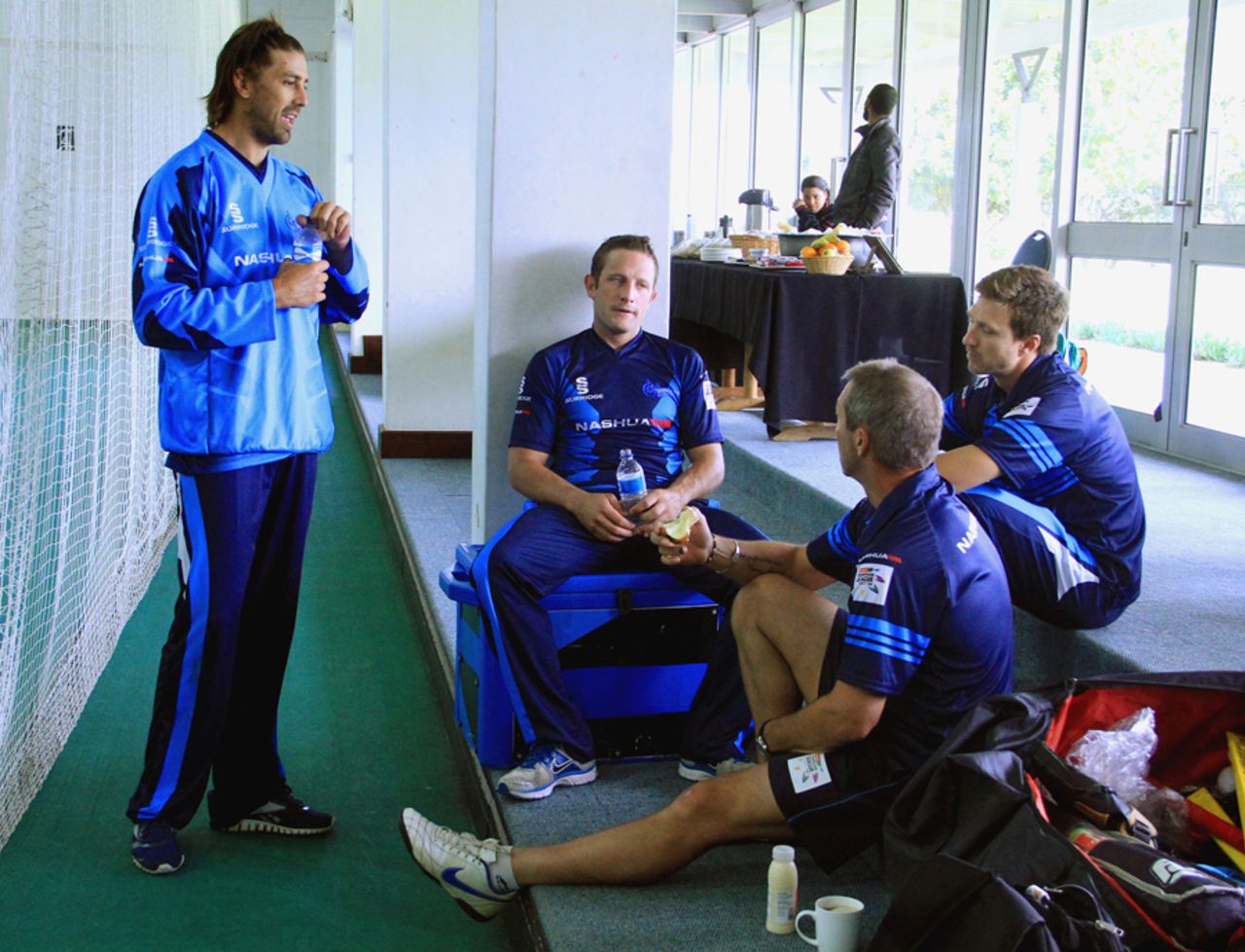 David Wiese (standing) talks to his team-mates and coach (sitting, right) during training, Cape Town, October 19, 2012