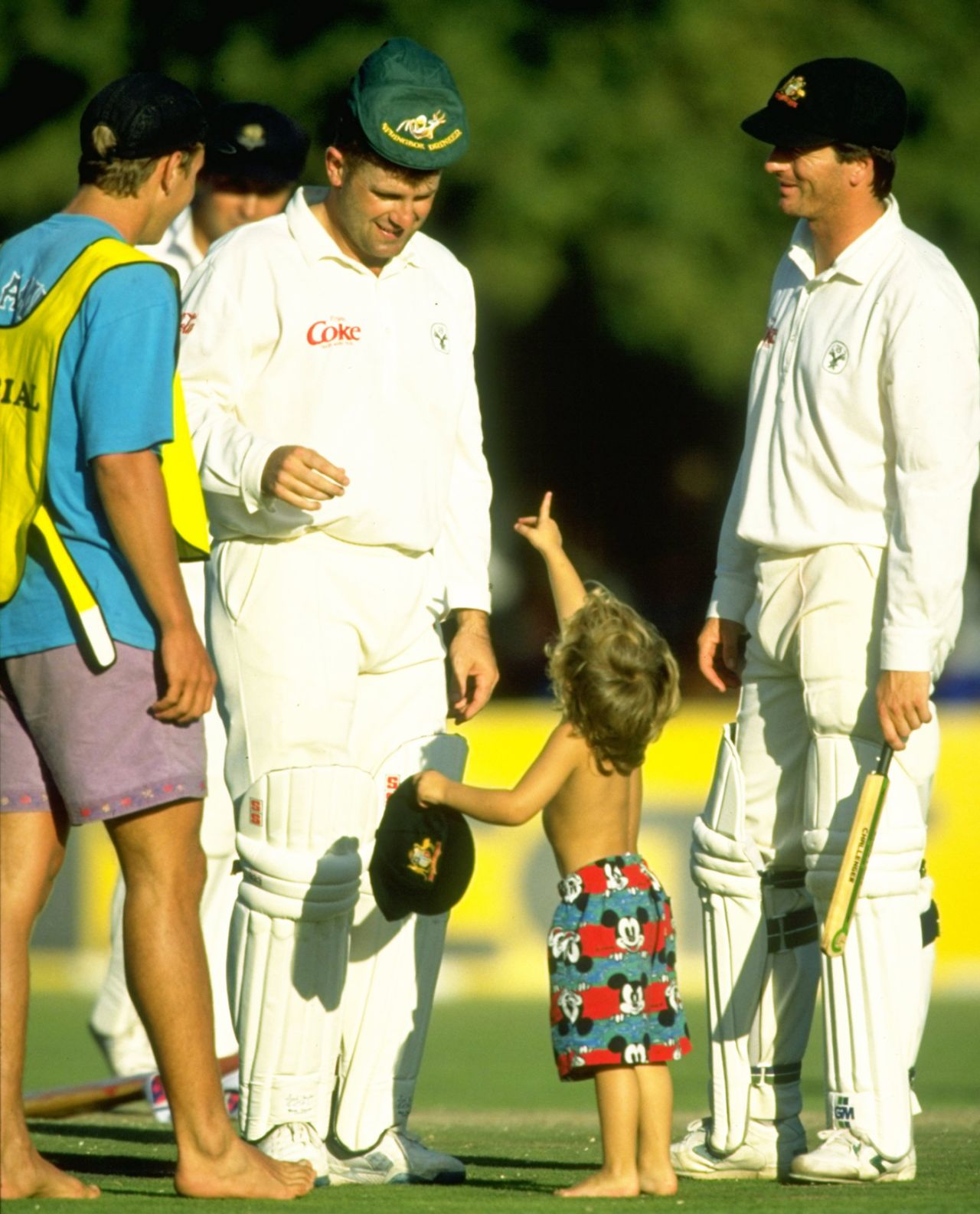 Mark Taylor and Steve Waugh enjoy meeting a young pitch invader, Australians v Boland, Stellenbosch, 2nd day, March 13, 1994