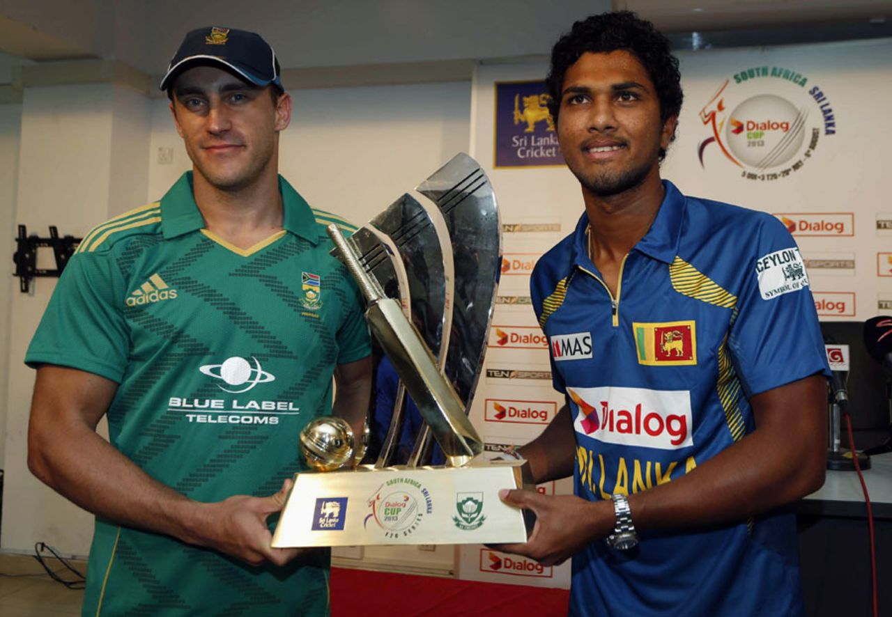 Faf du Plessis and Dinesh Chandimal pose with the Twenty20 trophy, Colombo, August 1, 2013