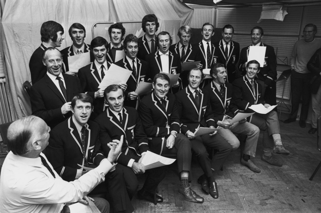 Commentator Brian Johnston conducts the victorious England squad in a rendition of "The Ashes Song" at the Decca studio in London, April 19, 1971