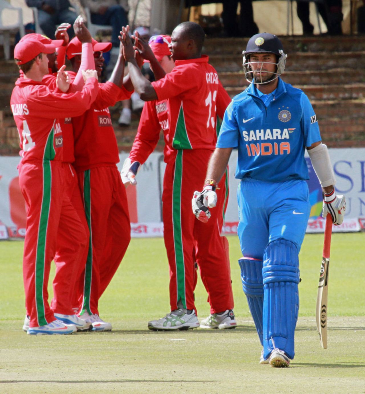 Cheteshwar Pujara walks after being bowled for 13, Zimbabwe v India, 4th ODI, Bulawayo, August 1, 2013