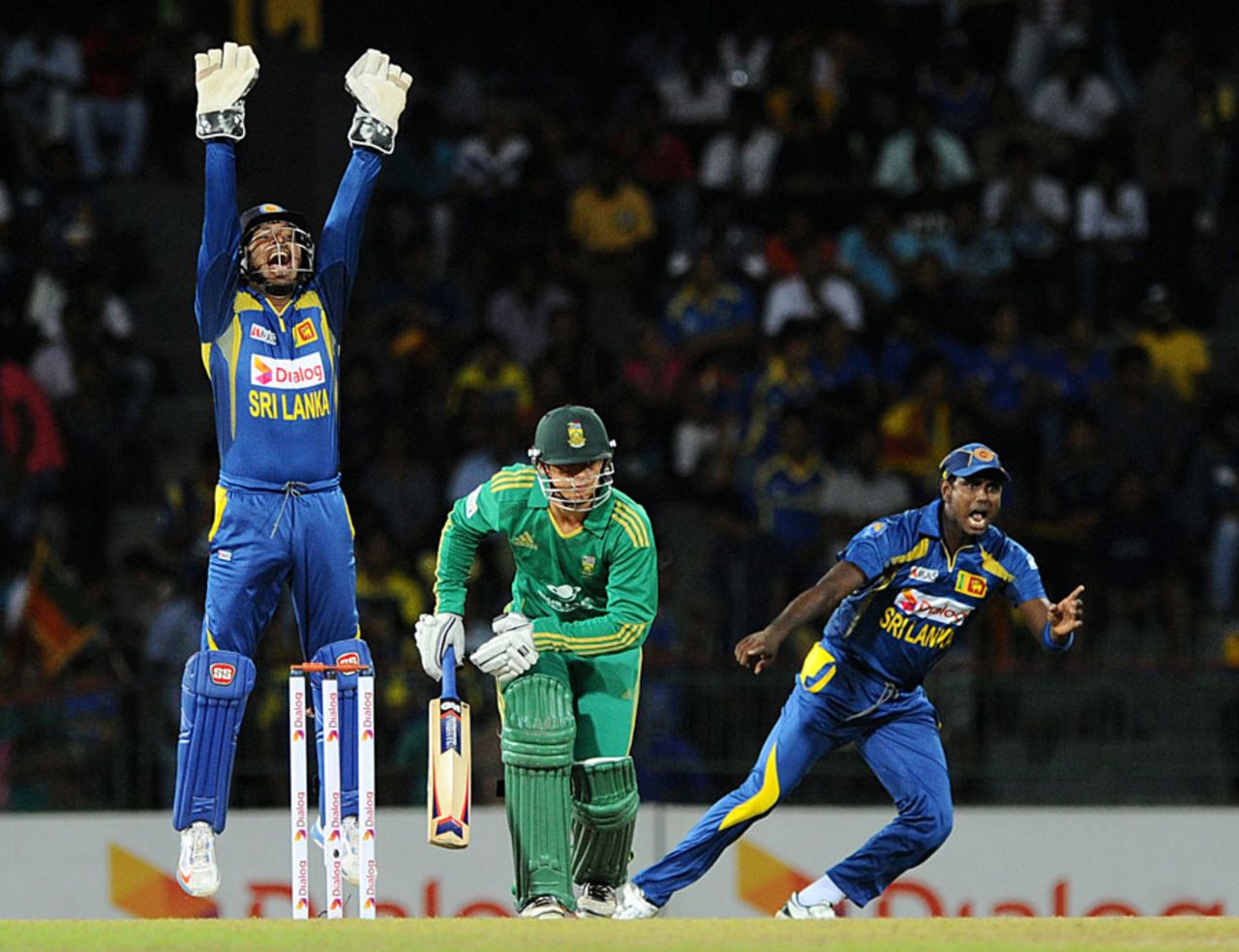 Kumar Sangakkara and Angelo Mathews appeal for the wicket of Quinton de Kock, Sri Lanka v South Africa, 1st T20, Colombo, August 2, 2013