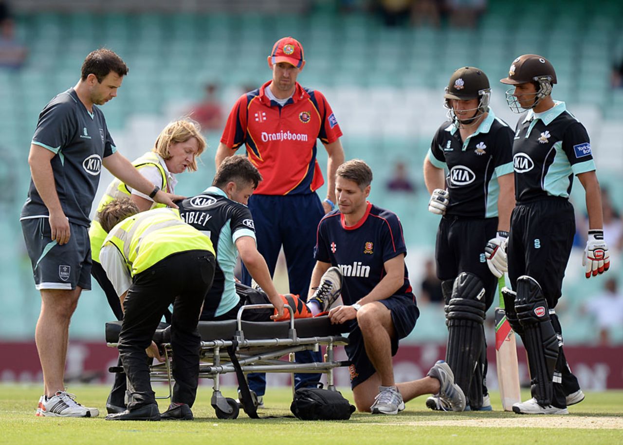 Dominic Sibley is stretchered off the field with a knee injury, Surrey v Essex, YB40, The Oval, August 2, 2013
