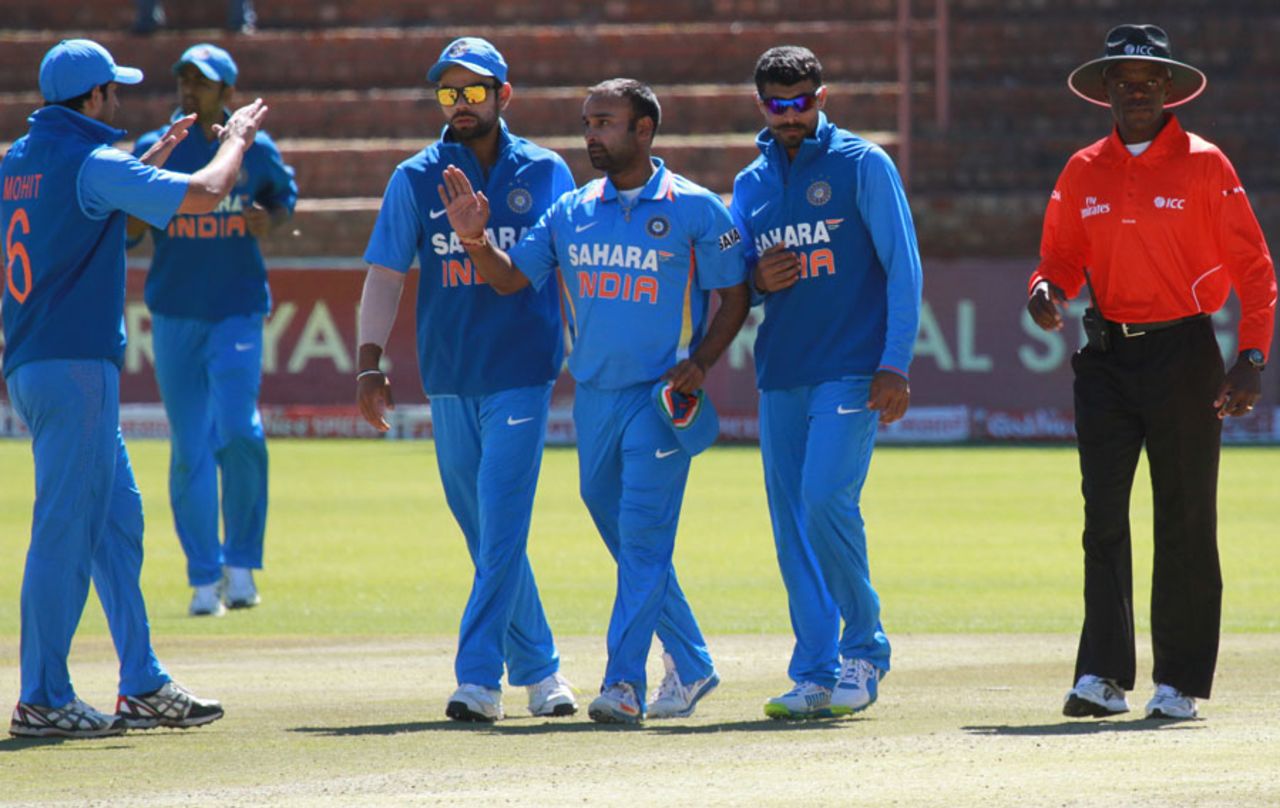 Amit Mishra is congratulated after taking a wicket, Zimbabwe v India, 5th ODI, Bulawayo, August 3, 2013
