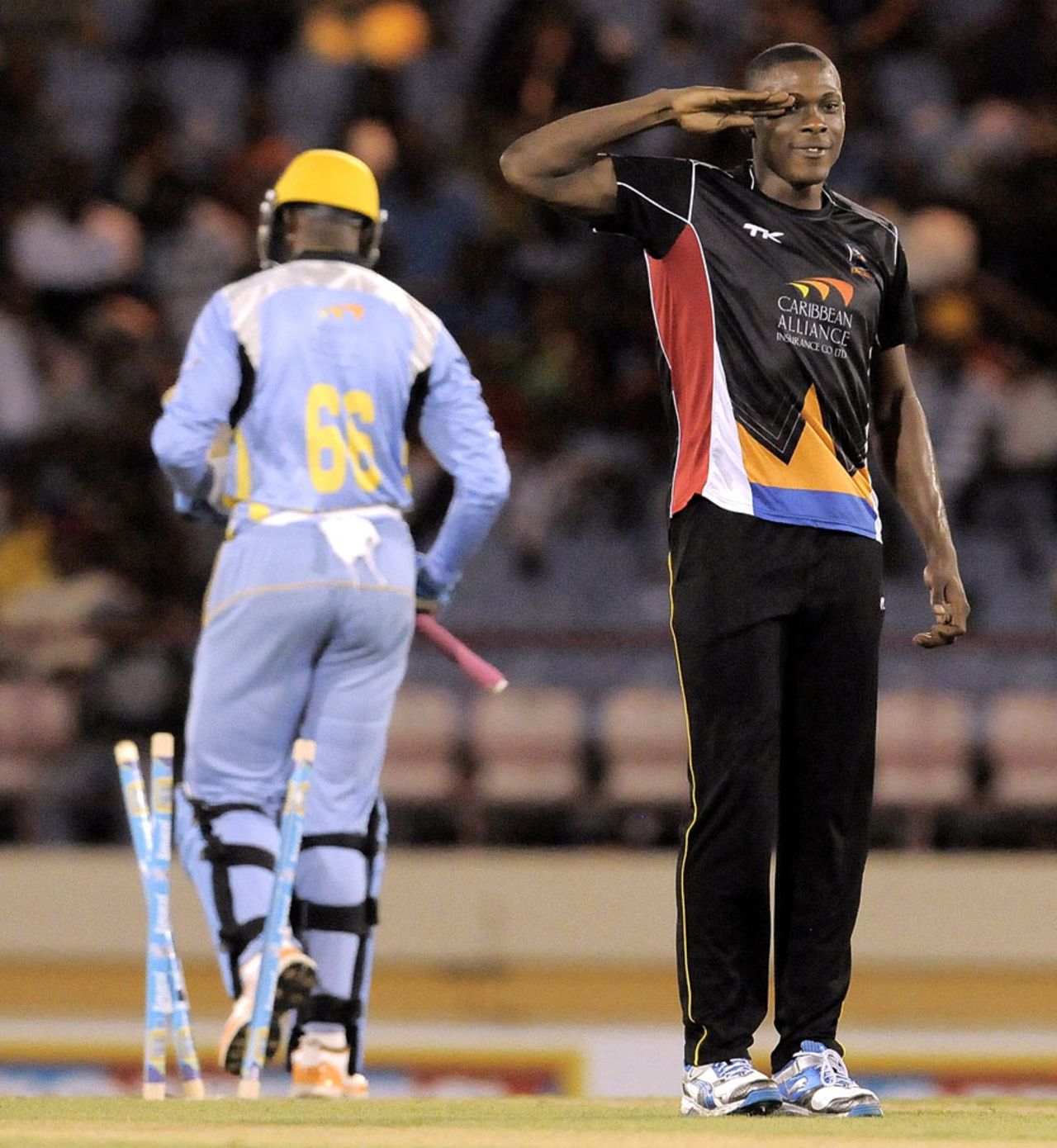 Military man Sheldon Cotterrell sends off a batsman with a salute, St Lucia Zouks v Antigua Hawksbills, Caribbean Premier League, Gros Islet, August 6, 2013 