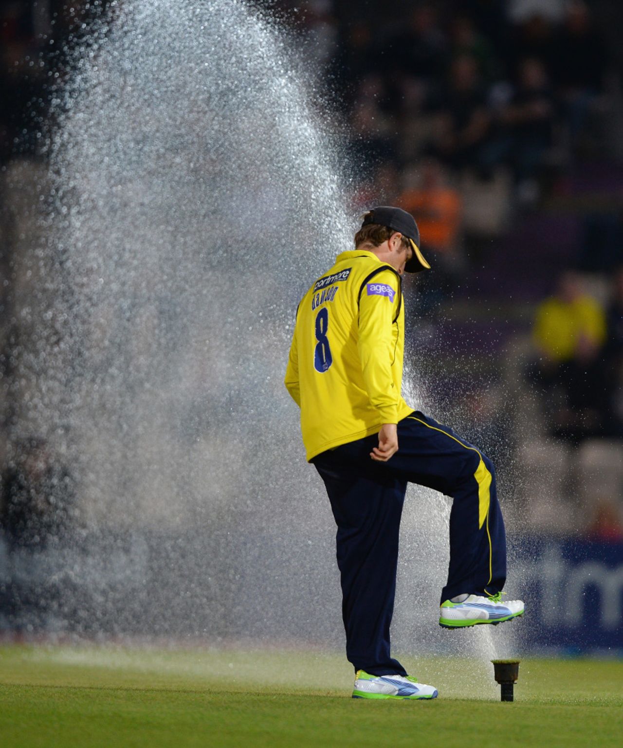 Liam Dawson tries to stop a sprinkler, Hampshire v Lancashire, Friends Life t20 quarter-final, Ageas Bowl, August 7, 2013