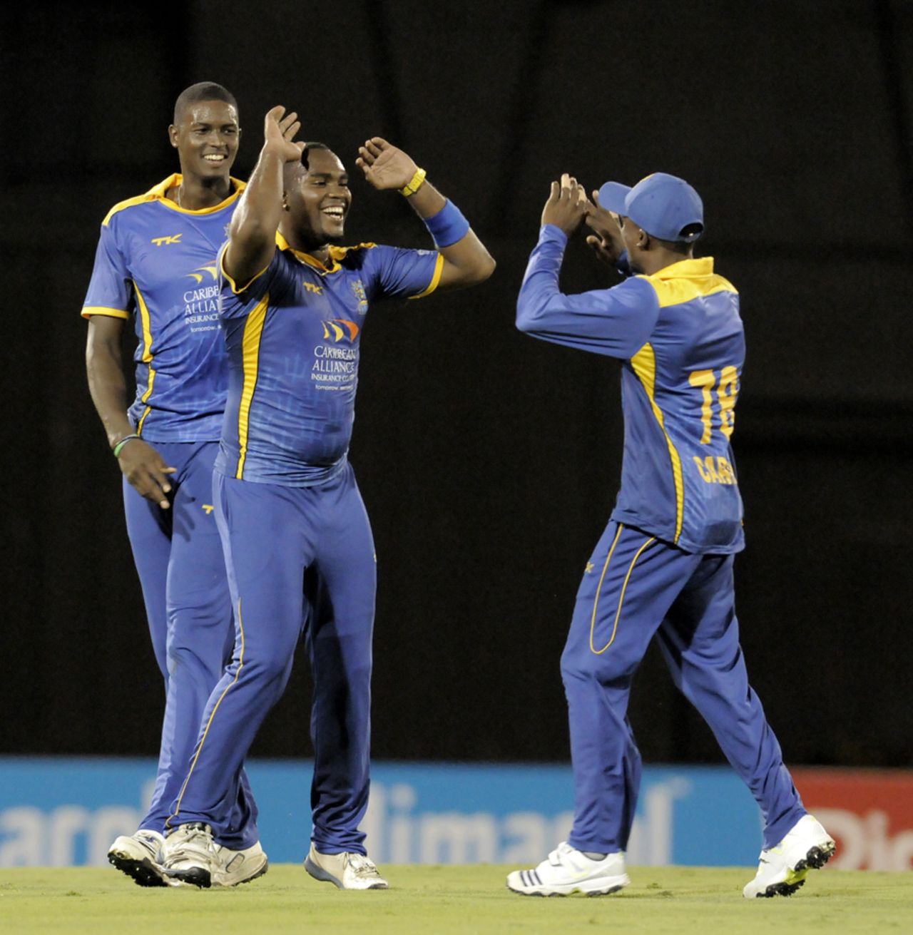 Barbados Tridents get together after one of Ashley Nurse's wickets, St Lucia Zouks v Barbados Tridents, Caribbean Premier League, St Lucia, August 8, 2013
