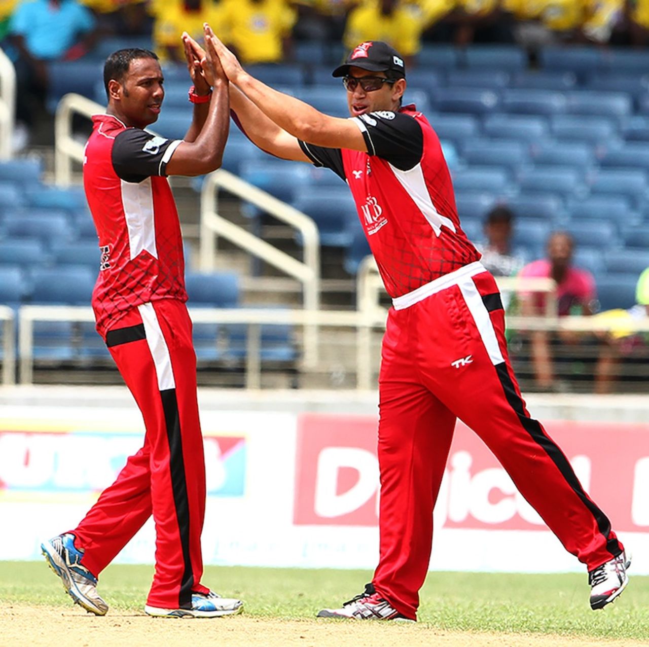 Samuel Badree is congratulated by Ross Taylor, Trinidad & Tobago Red Steel v St Lucia Zouks, Caribbean Premier League 2013, Jamaica, August 17, 2013
