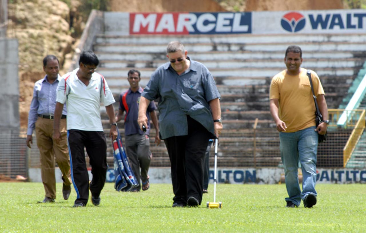 The ICC pitches consultant, Andy Atkinson supervises the track at the Sylhet Stadium, Sylhet, August 18, 2013