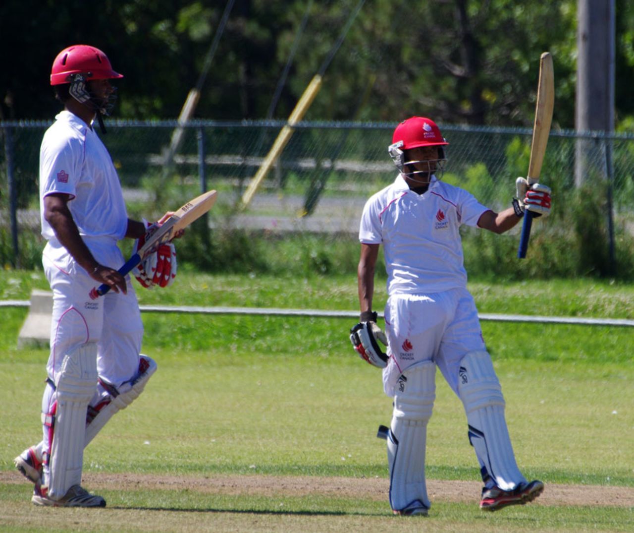 Salman Nazar raises his bat after scoring a half-century, Canada v Netherlands, ICC Intercontinental Cup, King City, 2nd day, August 23, 2013
