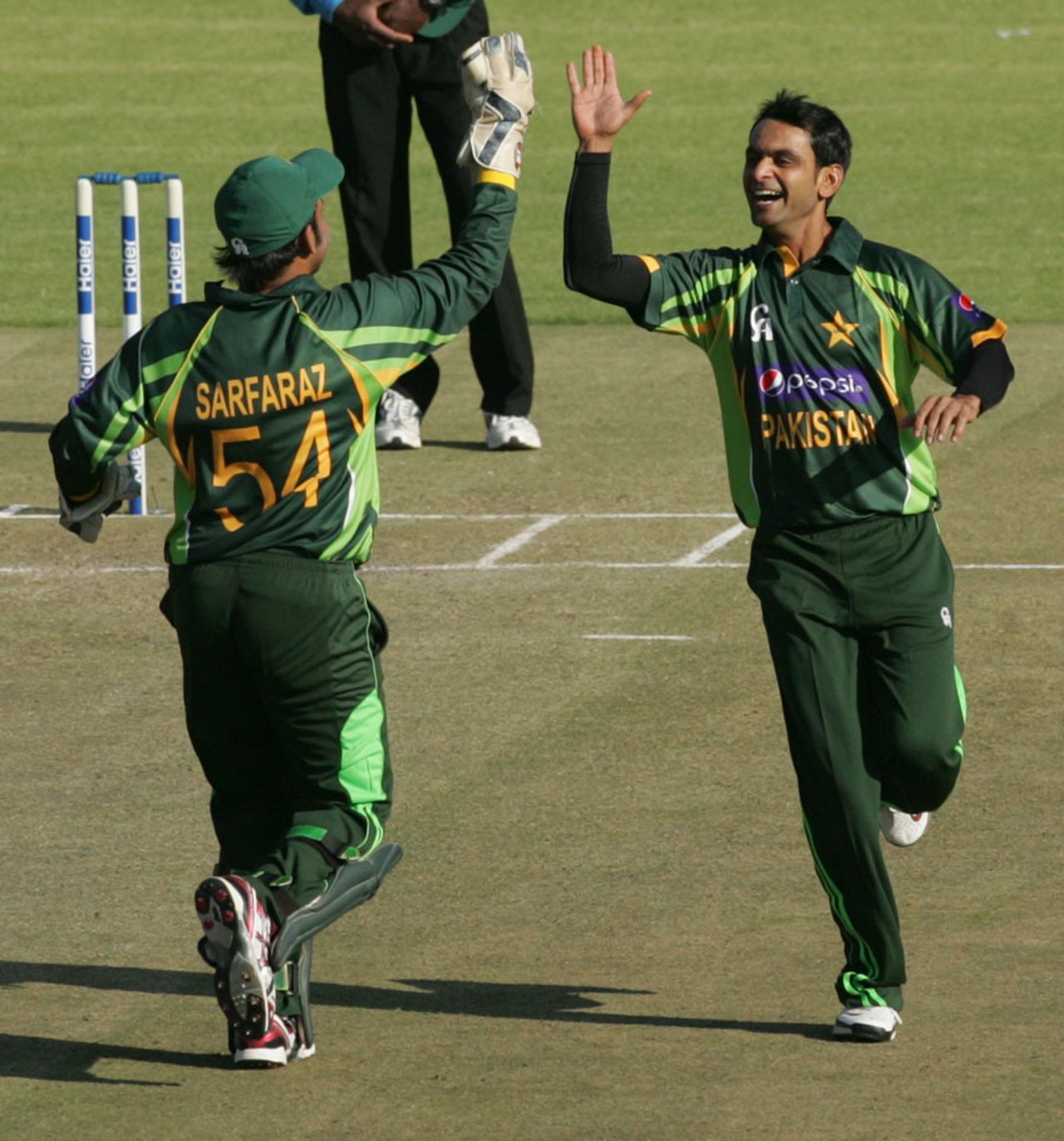 Mohammad Hafeez celebrates a wicket with Sarfraz Ahmed, Zimbabwe v Pakistan, 2nd T20I, Harare, August 24, 2013
