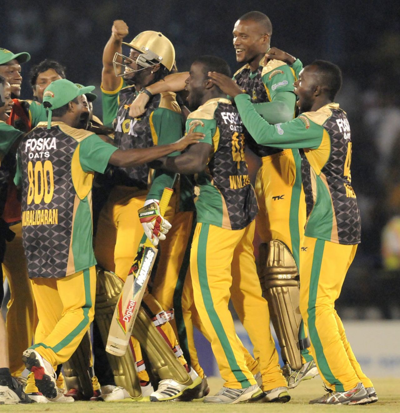 Chris Gayle is surrounded by team-mates after the win, Jamaica Tallawahs v Guyana Amazon Warriors, Caribbean Premier League 2013, final, Port-of-Spain, August 24, 2013