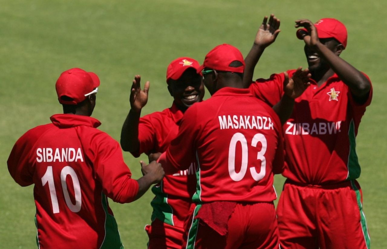Zimbabwe players celebrate the fall of a wicket, Zimbabwe v Pakistan, 1st ODI, Harare, August 27, 2013