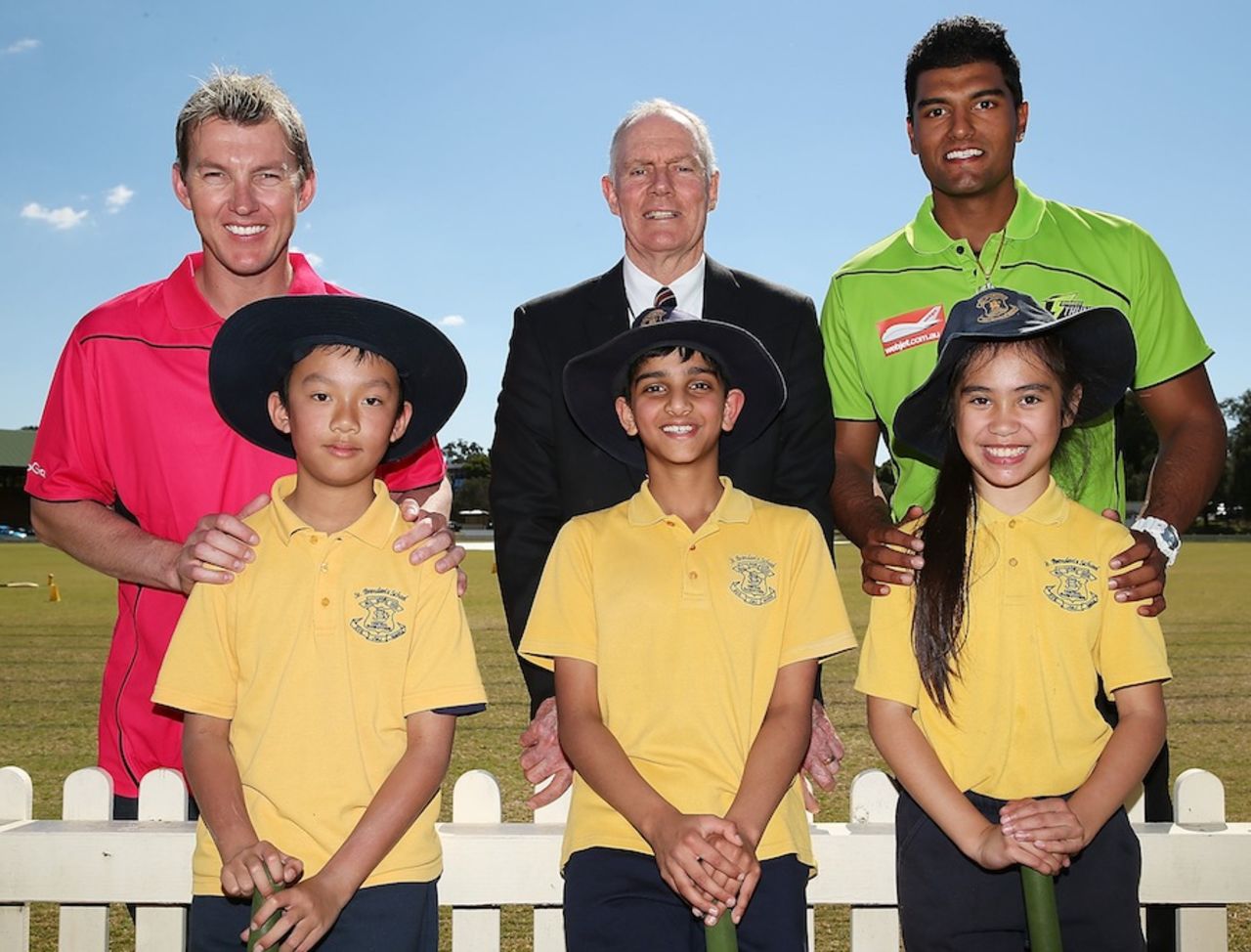 Brett Lee, Greg Chappell and Gurinder Sandhu pose with kids at a Cricket Australia community event, Sydney, August 28, 2013