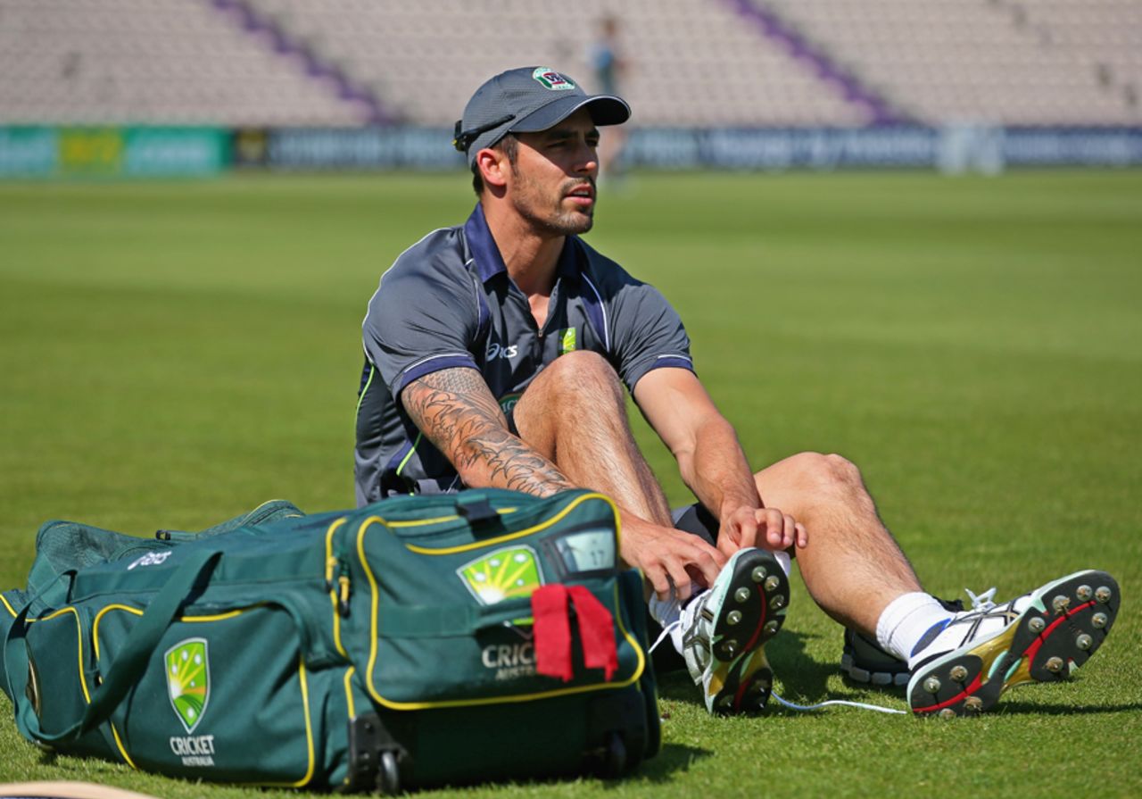 Mitchell Johnson pulls on his spikes, Southampton, August 28, 2013
