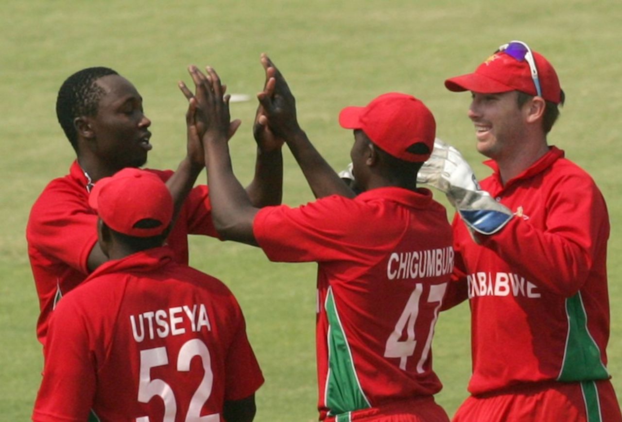 Tendai Chatara is congratulated after Nasir Jamshed's wicket, Zimbabwe v Pakistan, 3rd ODI, Harare, August 31, 2013
