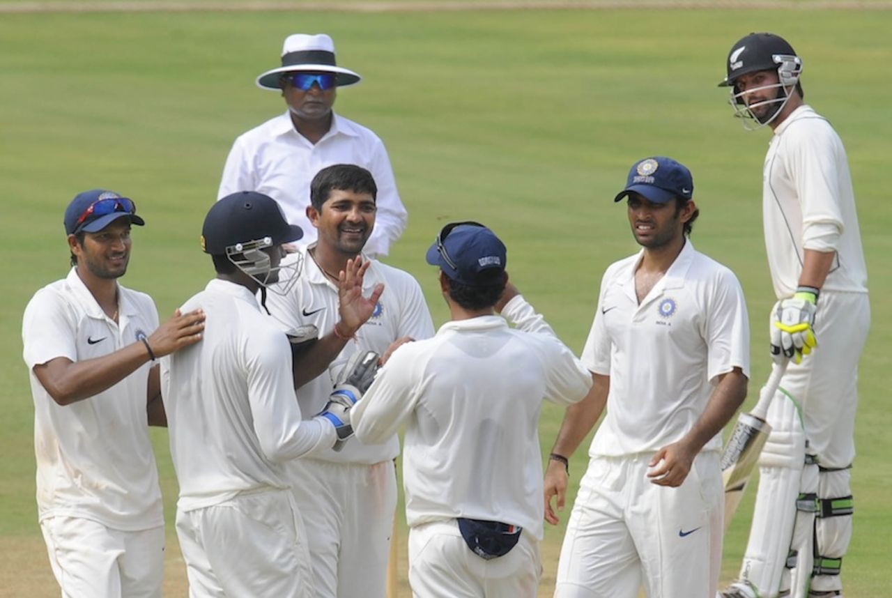 Rakesh Dhurv is congratulated after dismissing Corey Anderson, India A v New Zealand A, 2nd unofficial Test, Visakhapatnam, Sep 2, 2013