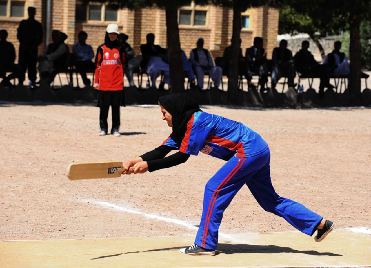 An Afghanistan woman looks to play a sweep, Herat, September 2, 2013
