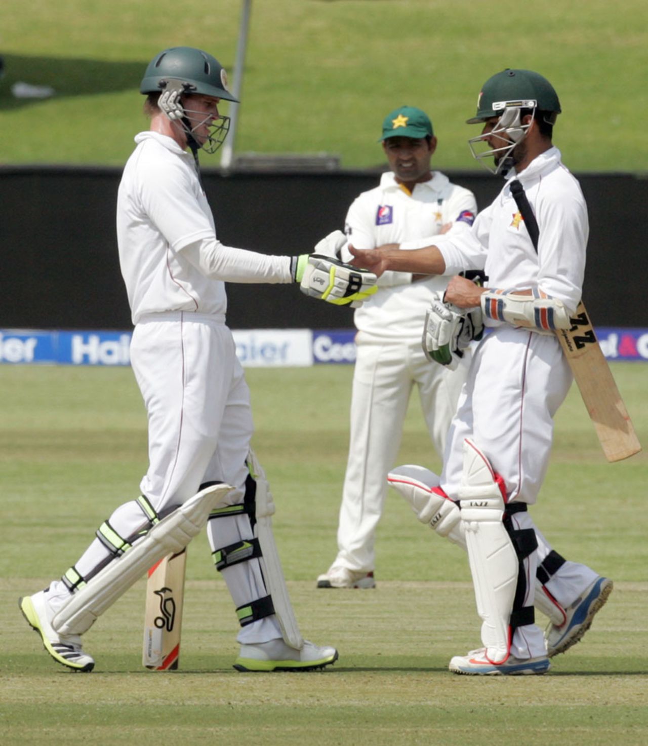 Sikandar Raza and Malcolm Waller shake hands during their fourth-wicket stand, Zimbabwe v Pakistan, 1st Test, Harare, 2nd day, September 4, 2013