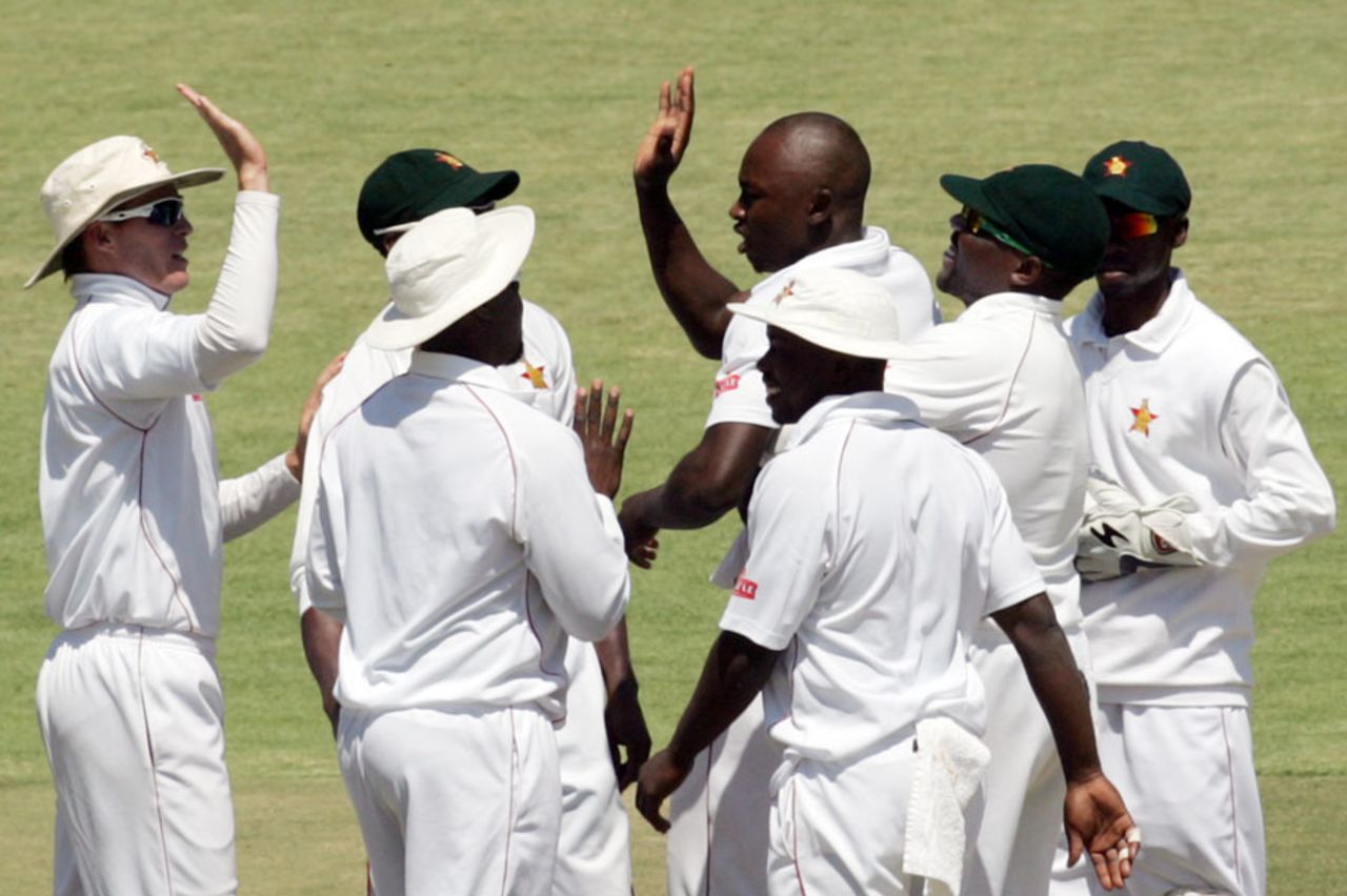 The Zimbabwe players celebrate a wicket, Zimbabwe v Pakistan, 1st Test, 3rd day, Harare, September 5, 2013