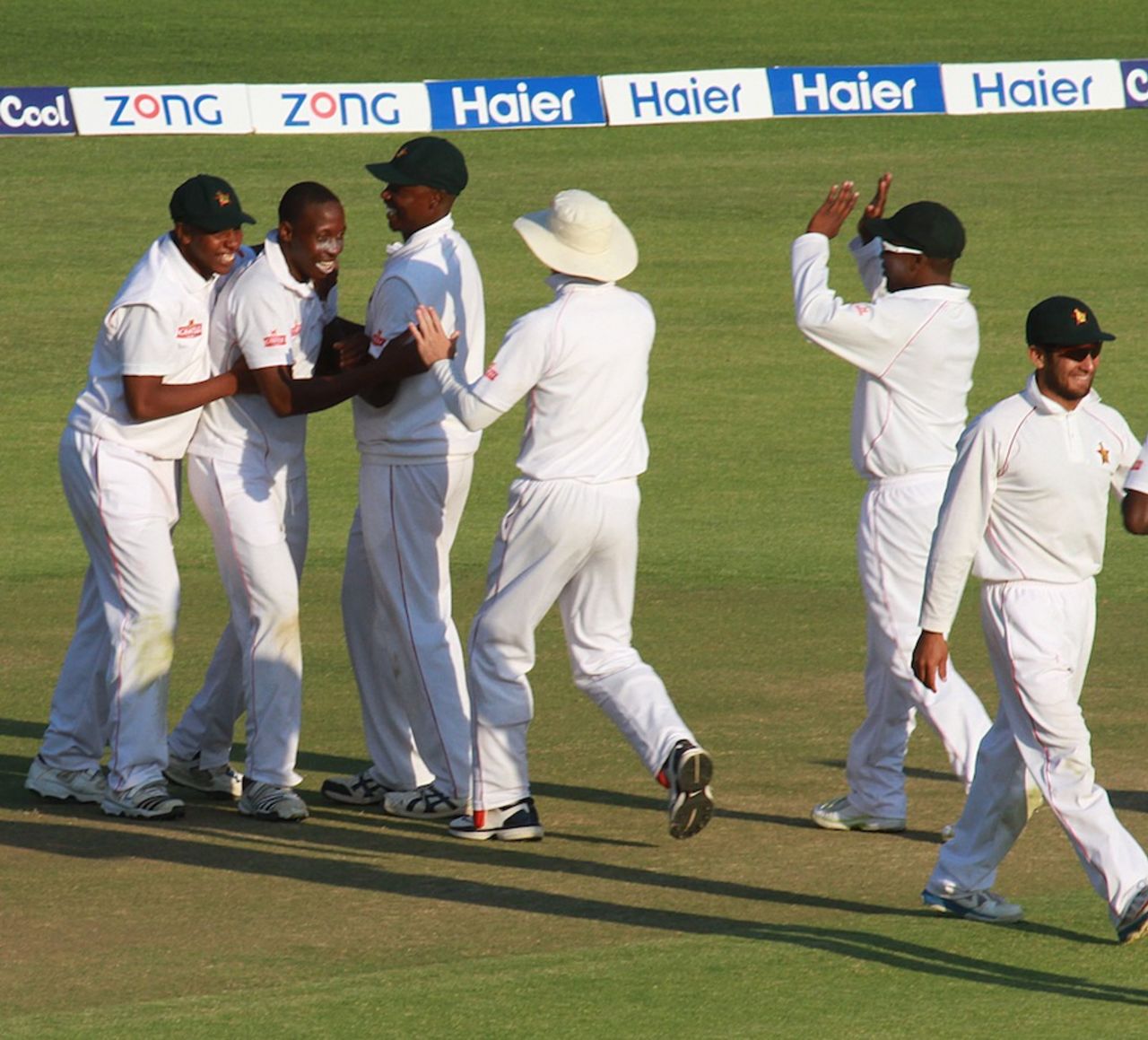 Shingi Masakadza is mobbed after dismissing Misbah-ul-Haq, Zimbabwe v Pakistan, 1st Test, 3rd day, Harare, September 5, 2013