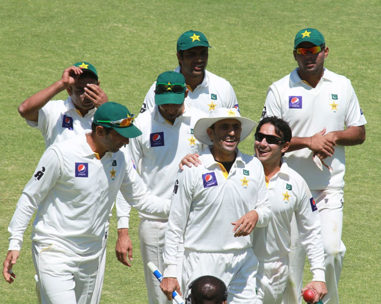 Younis Khan and Saeed Ajmal lead the players off the field after the win, Zimbabwe v Pakistan, 1st Test, 5th day, Harare, September 7, 2013