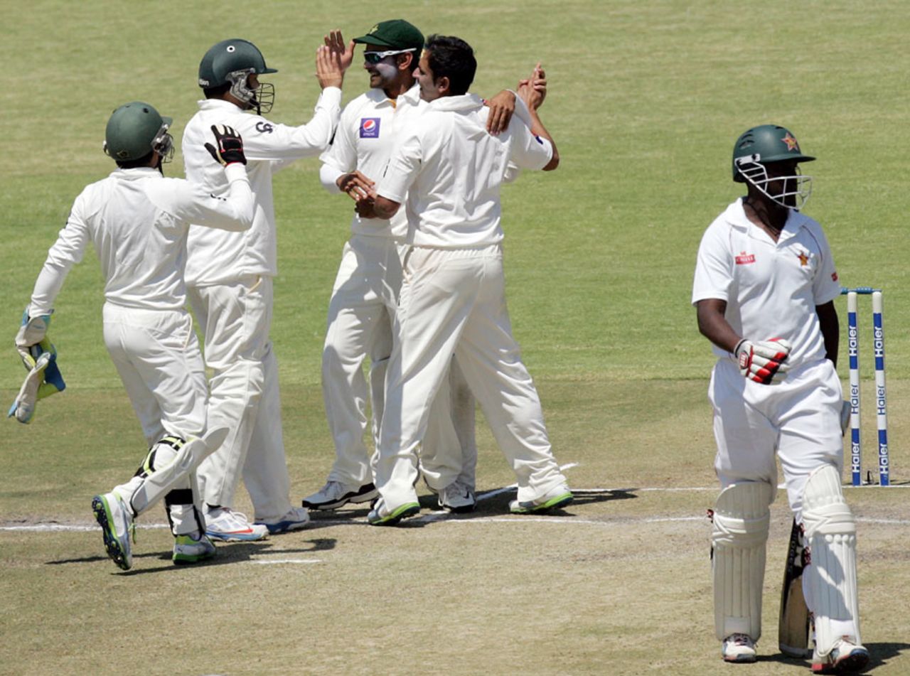 Abdur Rehman is congratulated after the dismissal of Elton Chigumbura, Zimbabwe v Pakistan, 1st Test, 5th day, Harare, September 7, 2013