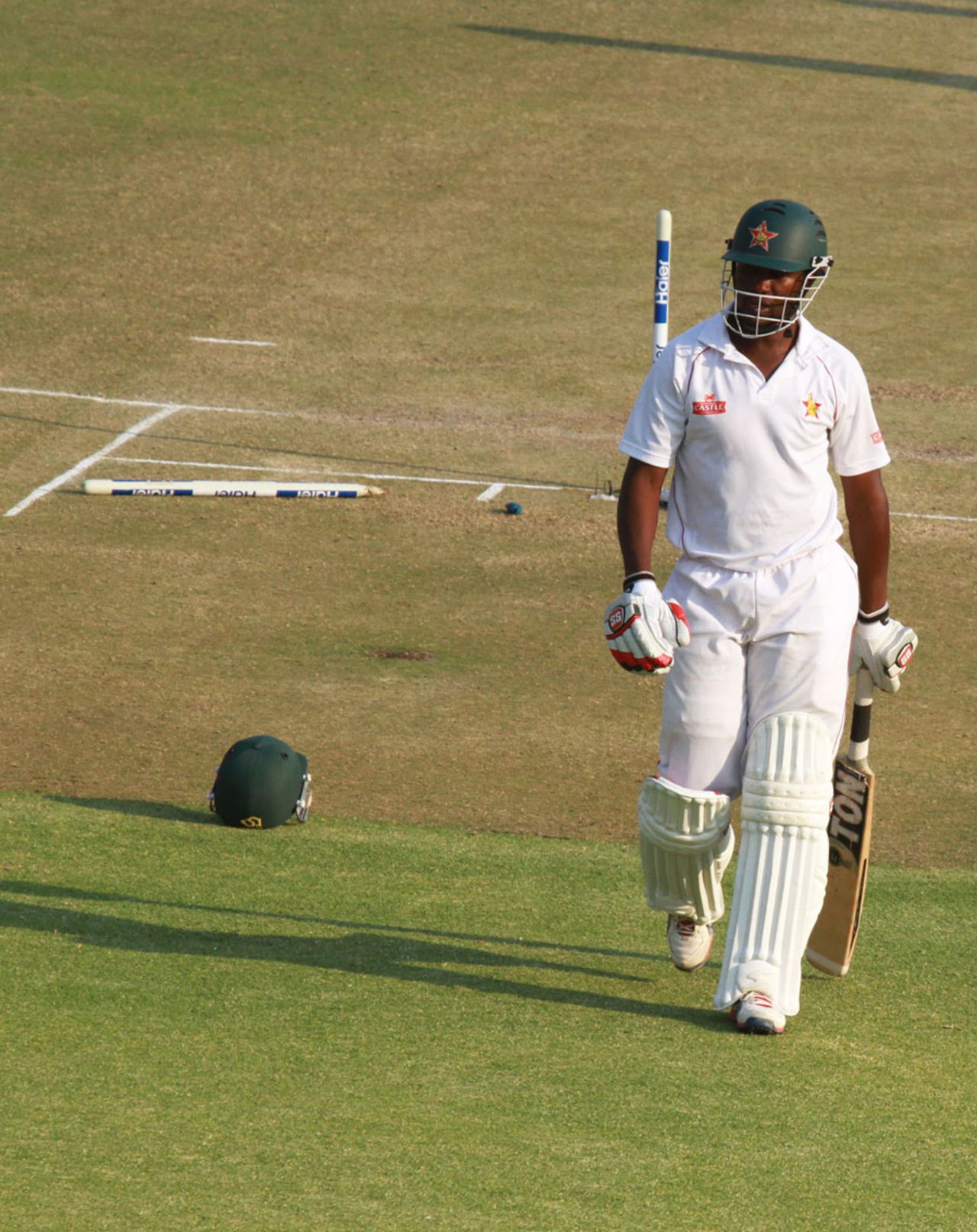 Elton Chigumbura walks back after being bowled by Abdur Rehman, 2nd Test, Harare, 1st day, September 10, 2013