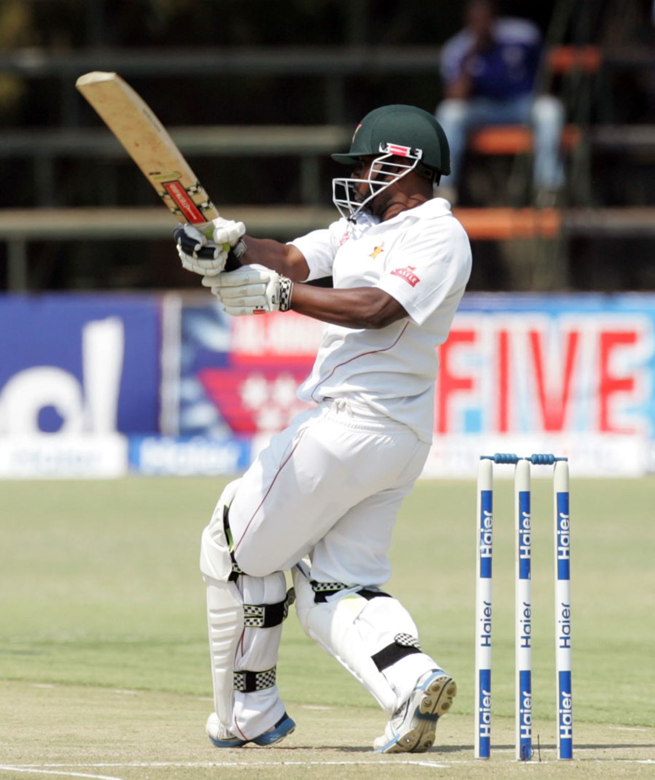 Prosper Utseya rocks back to pull the ball, Zimbabwe v Pakistan, 2nd Test, Harare, 2nd day, September 11, 2013