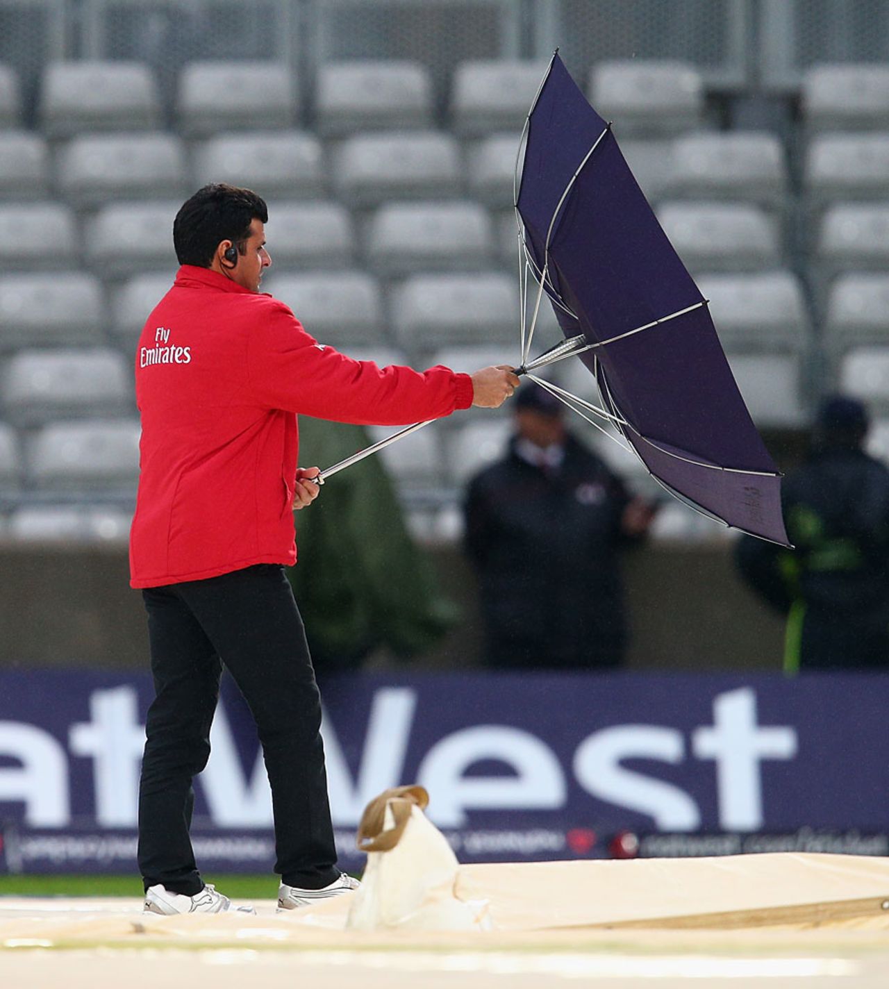 Aleem Dar struggles to keep hold of his umbrella, England v Australia, 3rd NatWest ODI, Edgbaston, September 11, 2013