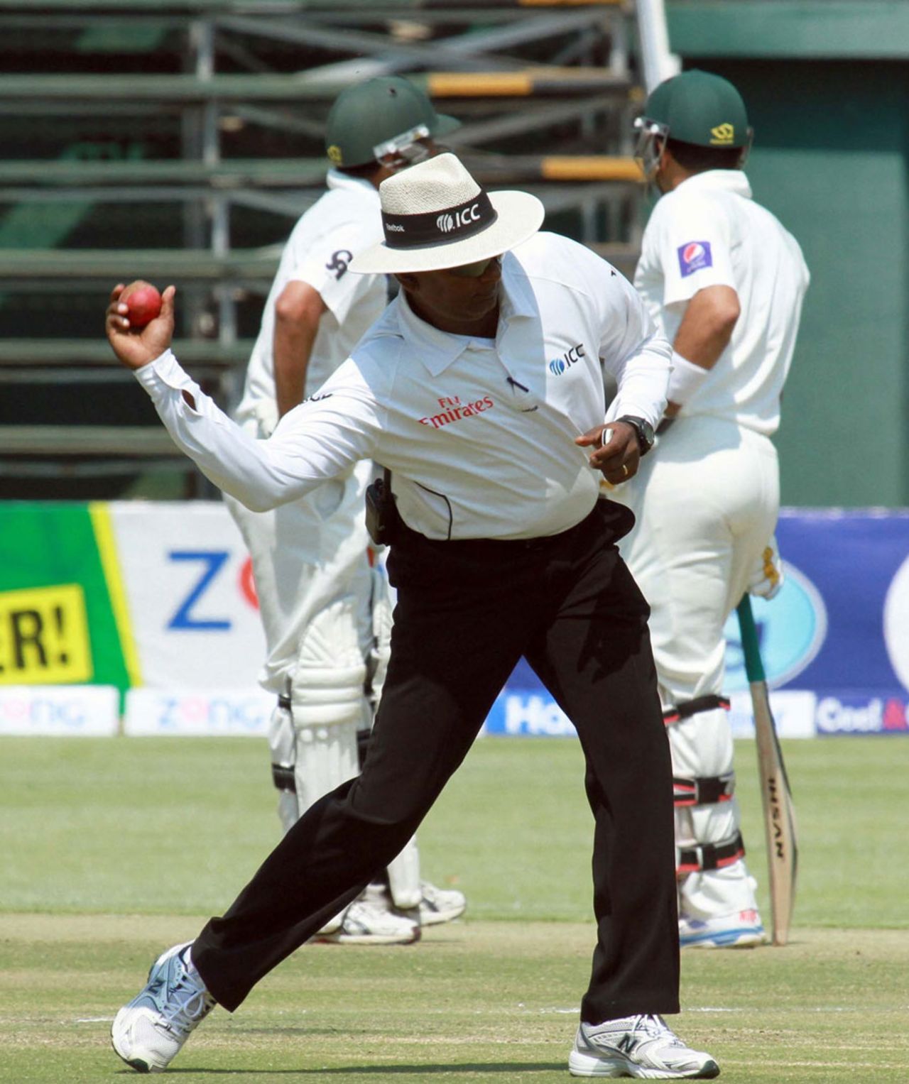 Umpire Ranmore Martinesz set to throw the ball, Zimbabwe v Pakistan, 2nd Test, Harare, 3rd day, September 12, 2013