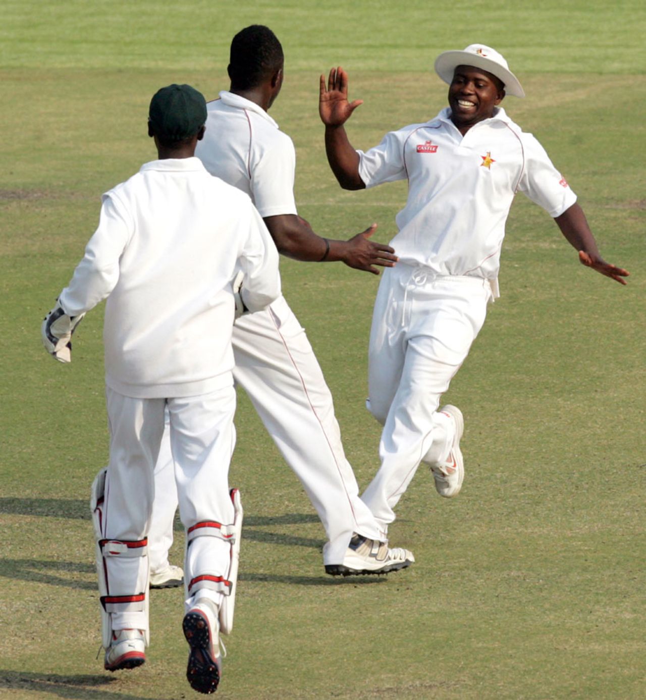 Prosper Utseya celebrates the wicket of Younis Khan with Brian Vitori, Zimbabwe v Pakistan, 2nd Test, Harare, 4th day, September 13, 2013