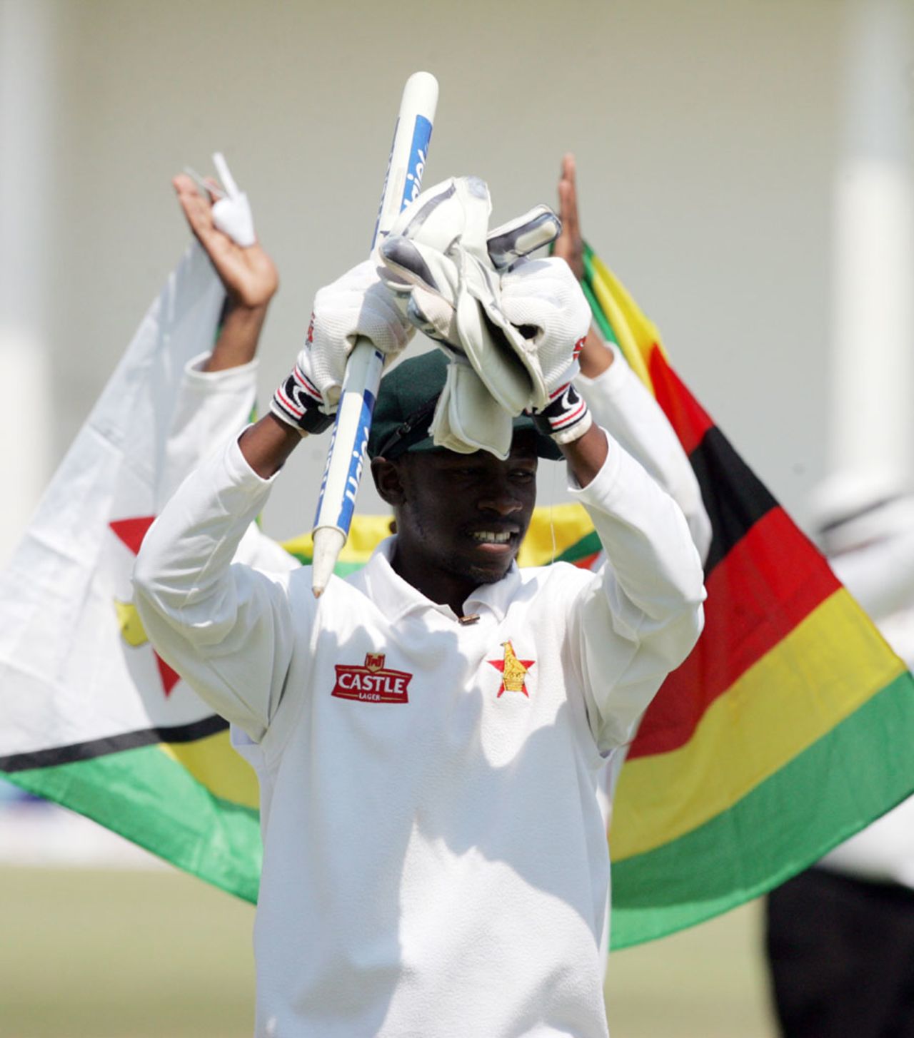 Richmond Mutumbami with the Zimbabwe flag behind him, Zimbabwe v Pakistan, 2nd Test, Harare, 5th day, September 14, 2013