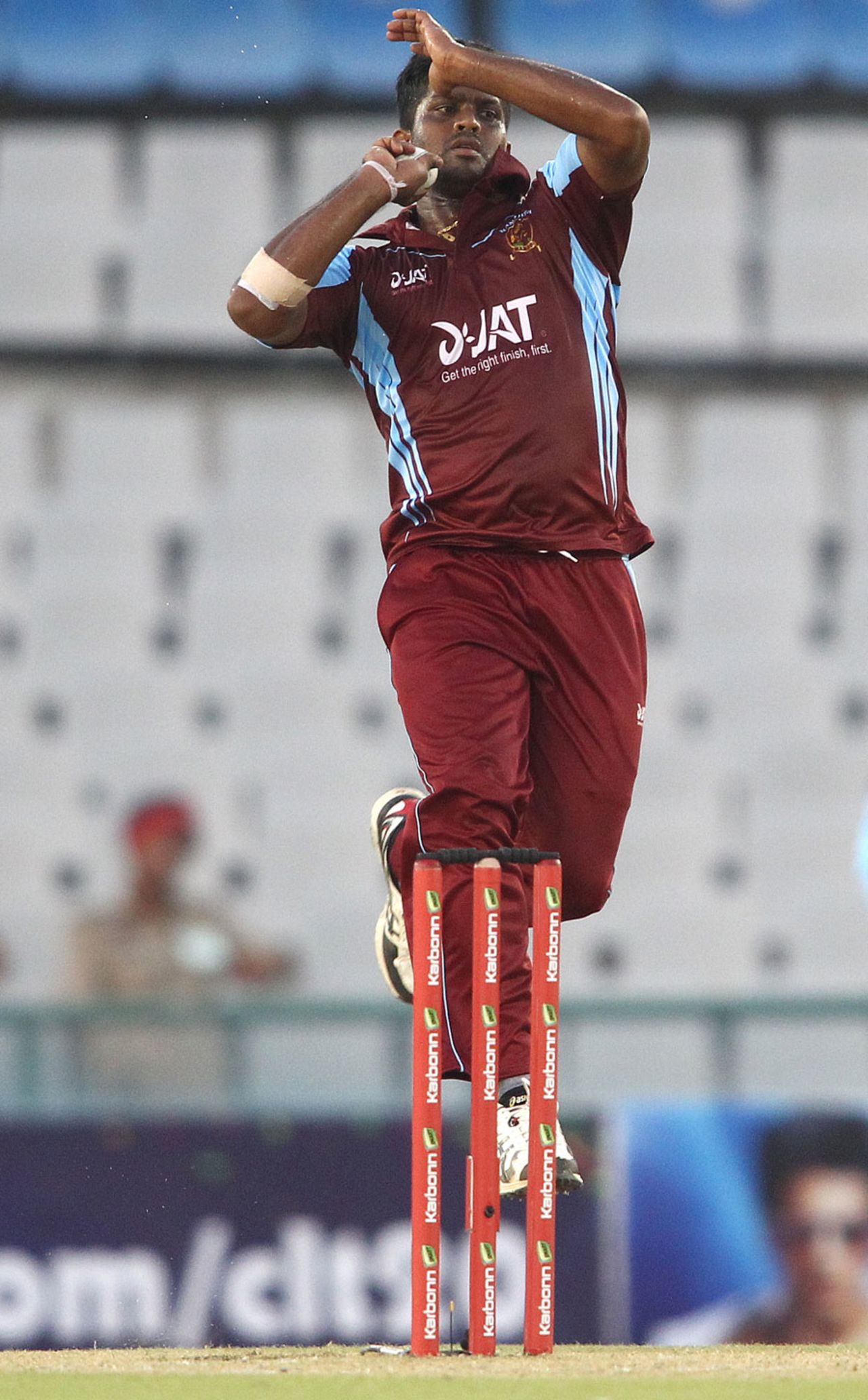 Dilhara Lokuhettige in his delivery stride, Kandurata Maroons v Otago Volts, Champions League Qualifiers, Mohali, September 18, 2013