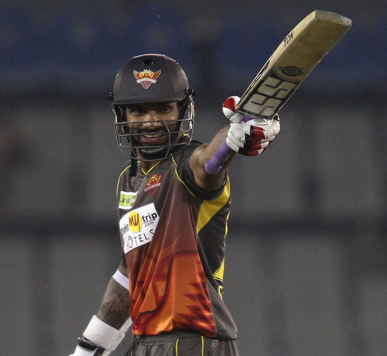 Shikhar Dhawan raises the bat after reaching his fifty, Faisalabad Wolves v Sunrisers Hyderabad, Champions League Qualifiers, Mohali, September 18, 2013