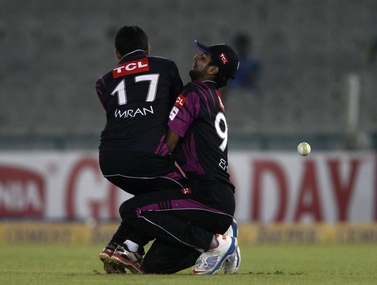 Imran Khalid and Ehsan Adil collided while attempting a catch, Faisalabad Wolves v Kandurata Maroons, Champions League Qualifiers, Mohali, September 20, 2013
