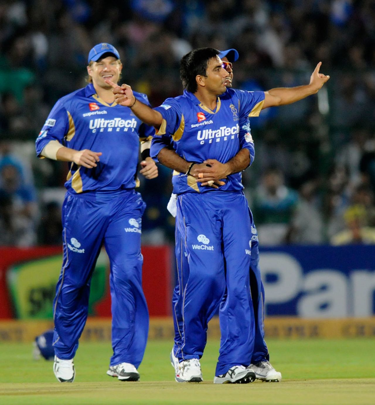 Vikramjeet Malik is embraced by team-mates after removing Dwayne Smith, Mumbai Indians v Rajasthan Royals, Champions League 2013, Mohali, September 21, 2013