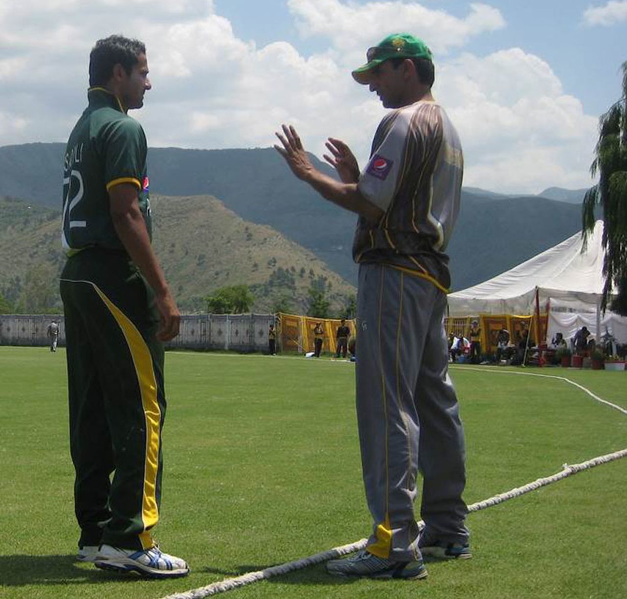 Mohammad Akram instructs one of his wards amid a magnificent backdrop, Karachi, April 26, 2013