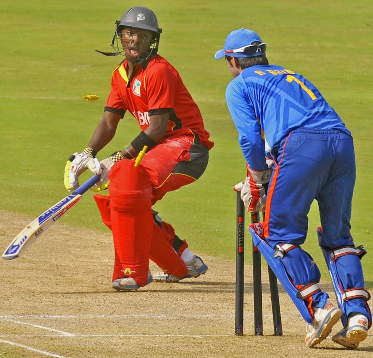 Shoun Handirisi is stumped by Ankush Bains, India Under-19s v Zimbabwe Under-19s, Visakhapatnam, Sep 23, 2013