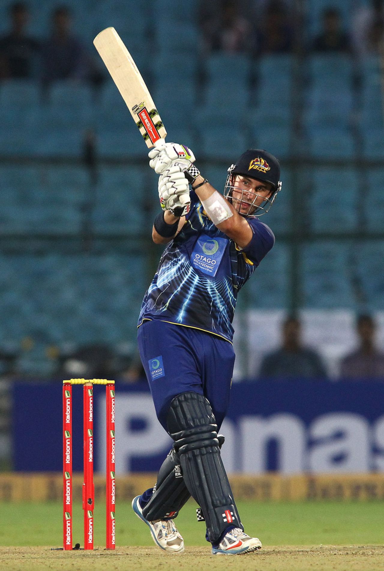 Hamish Rutherford lofts the ball over the leg side, Lions v Otago, Group A, Champions League 2013, Jaipur, September 29, 2013