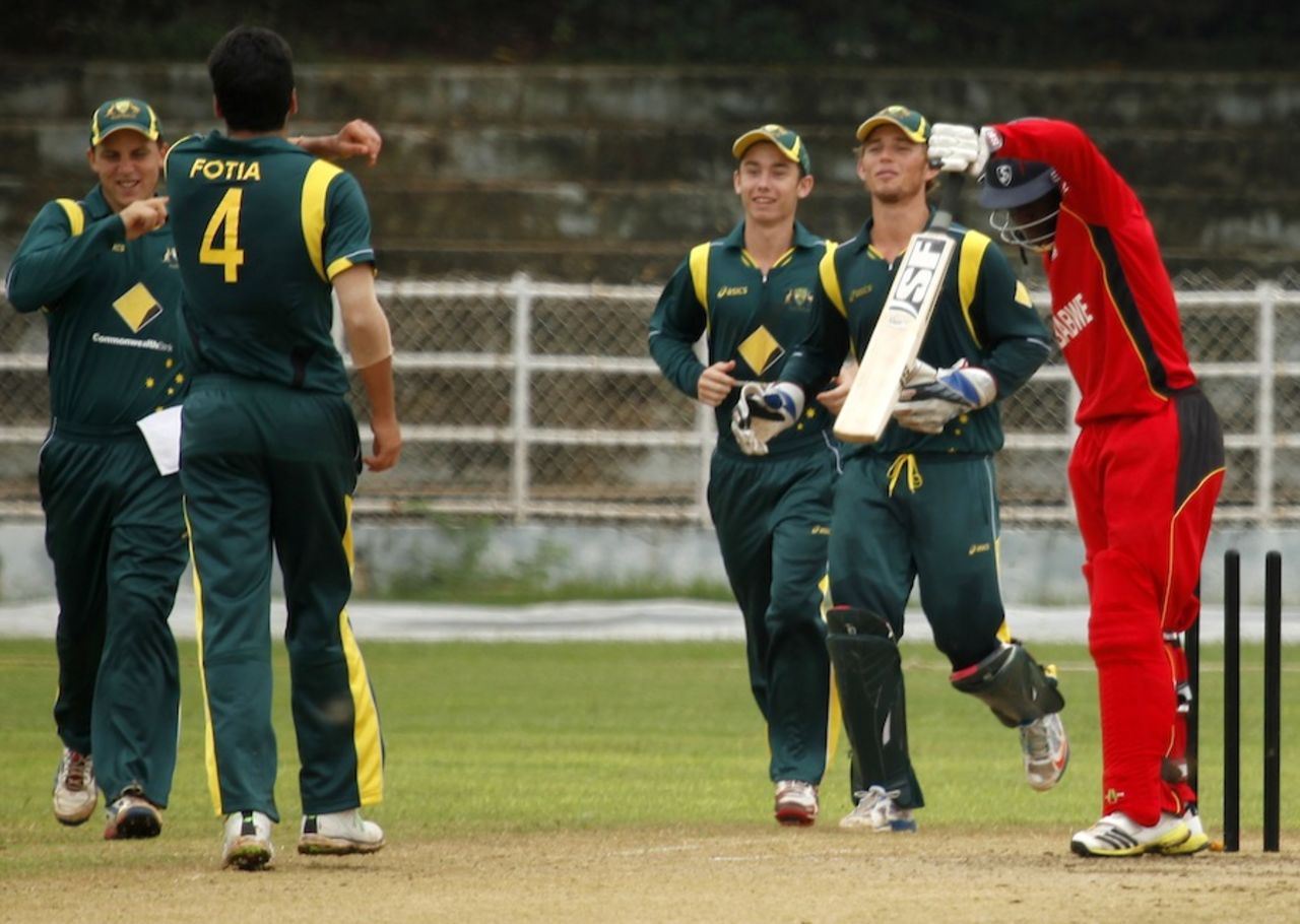 Matthew Fotia and team-mates celebrate a wicket, Australia Under-19s v Zimbabwe Under-19s, Visakhapatnam, October 1, 2013 