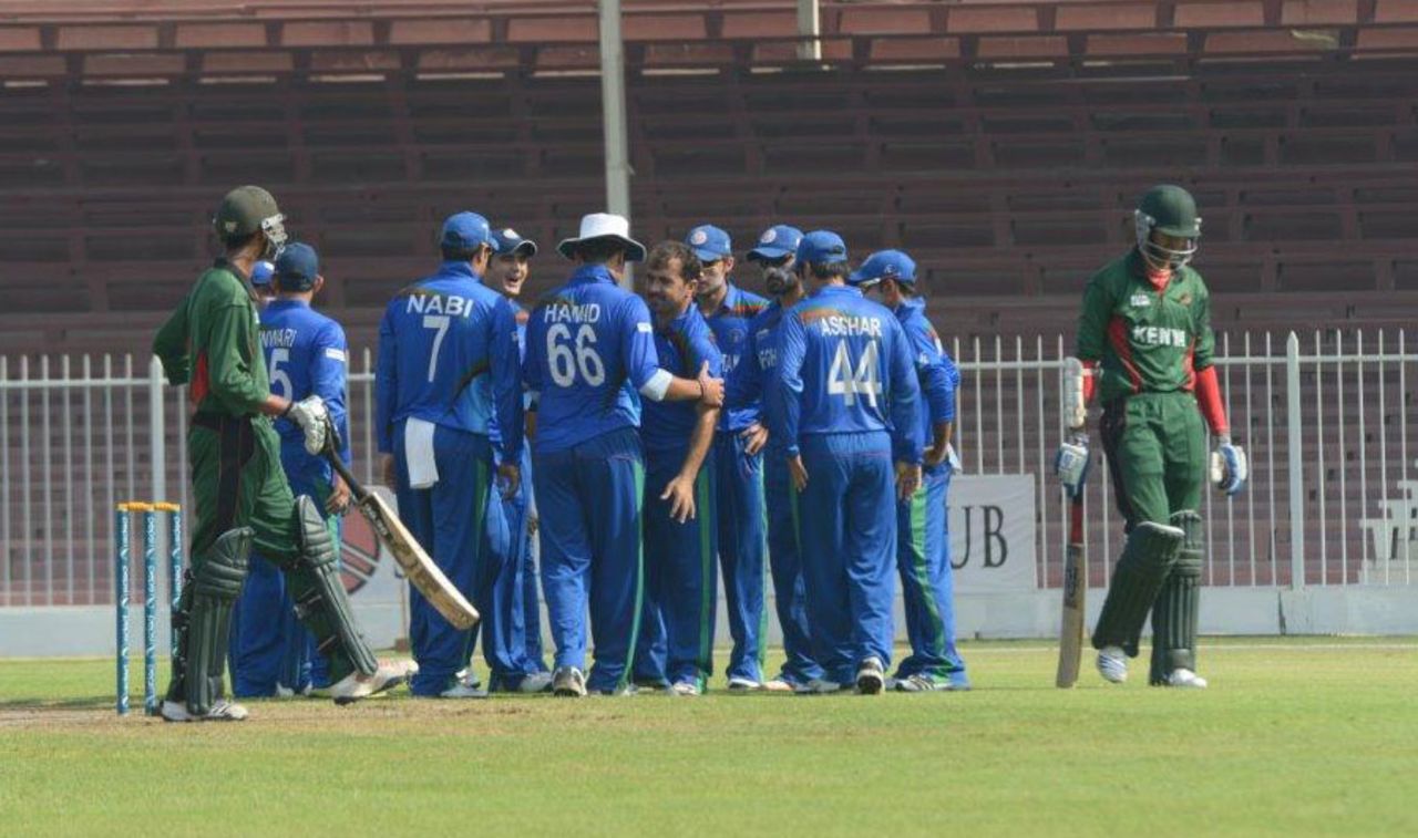 Offspinner Karim Sadiq celebrates with team-mates after taking a wicket, Afghanistan v Kenya, WCL Championship, Sharjah, October 4, 2013