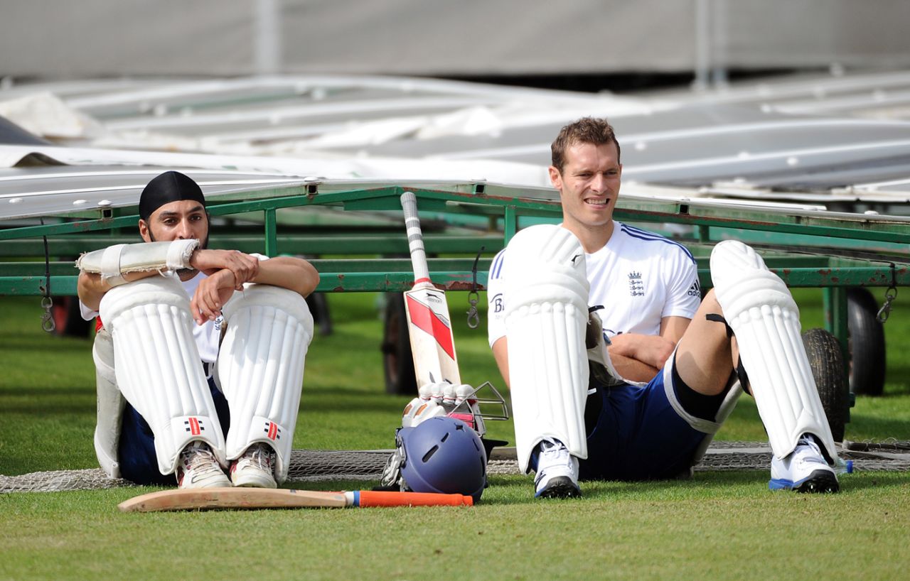 Monty Panesar and Chris Tremlett look on during a training session, Old Trafford, July 30, 2013