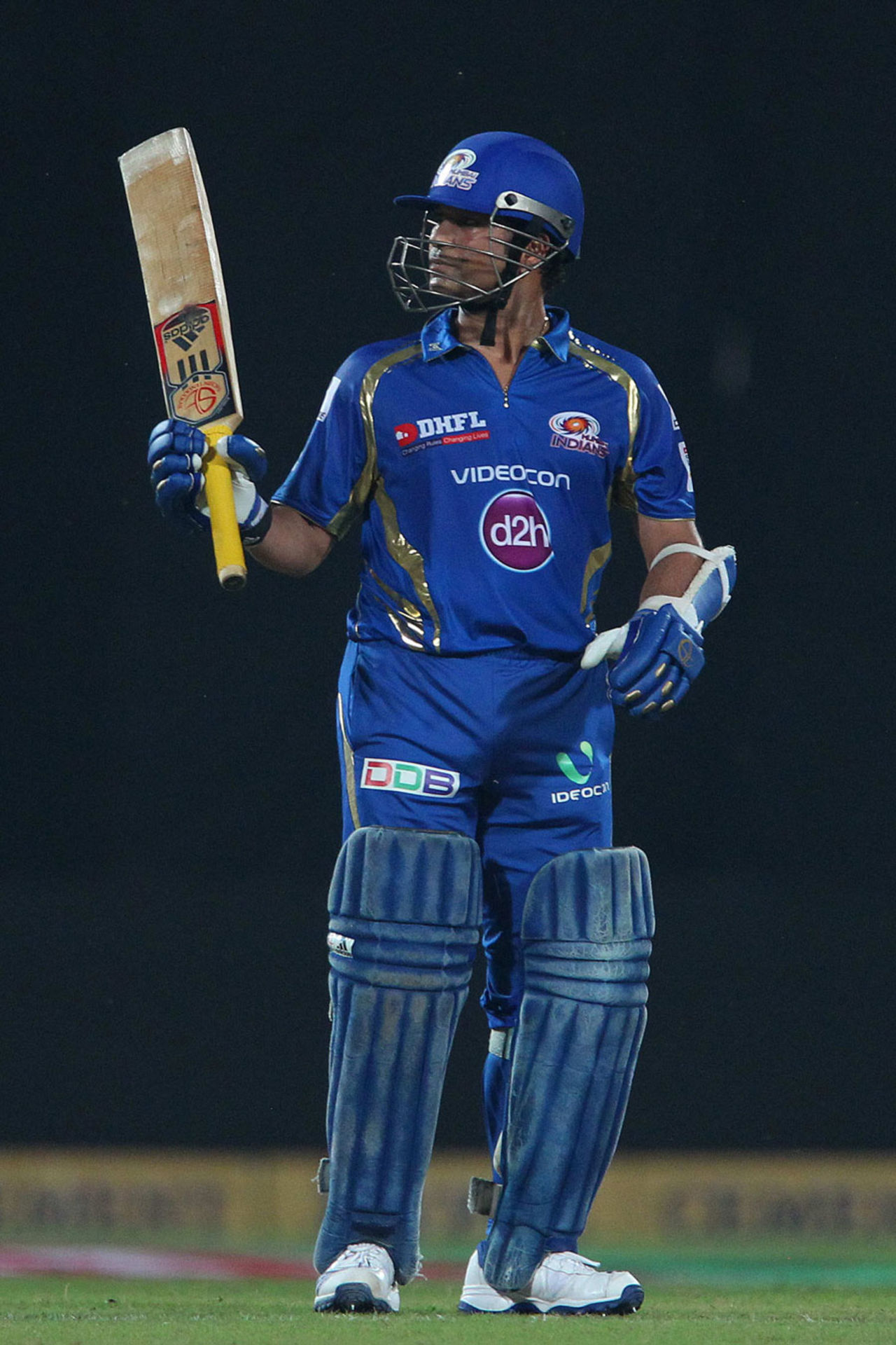 Sachin Tendulkar raises the bat after reaching 50000 career runs, Trinidad & Tobago v Mumbai Indians, Champions League 2013, 2nd Semi-Final, Delhi, October 5, 2013 