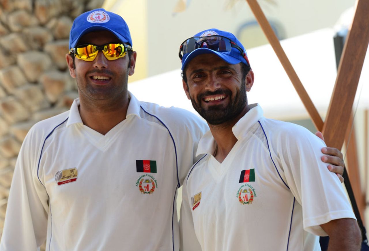 Mohammad Nabi and Nawroz Mangal watch the game from the sidelines, Afghanistan v Kenya, ICC Intercontinental Cup, 1st day, Dubai, October 6, 2013