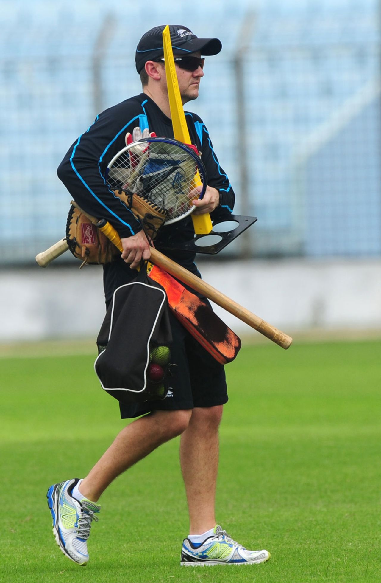 Mike Hesson carries training equipment during a practice session, Chittagong, October 7, 2013