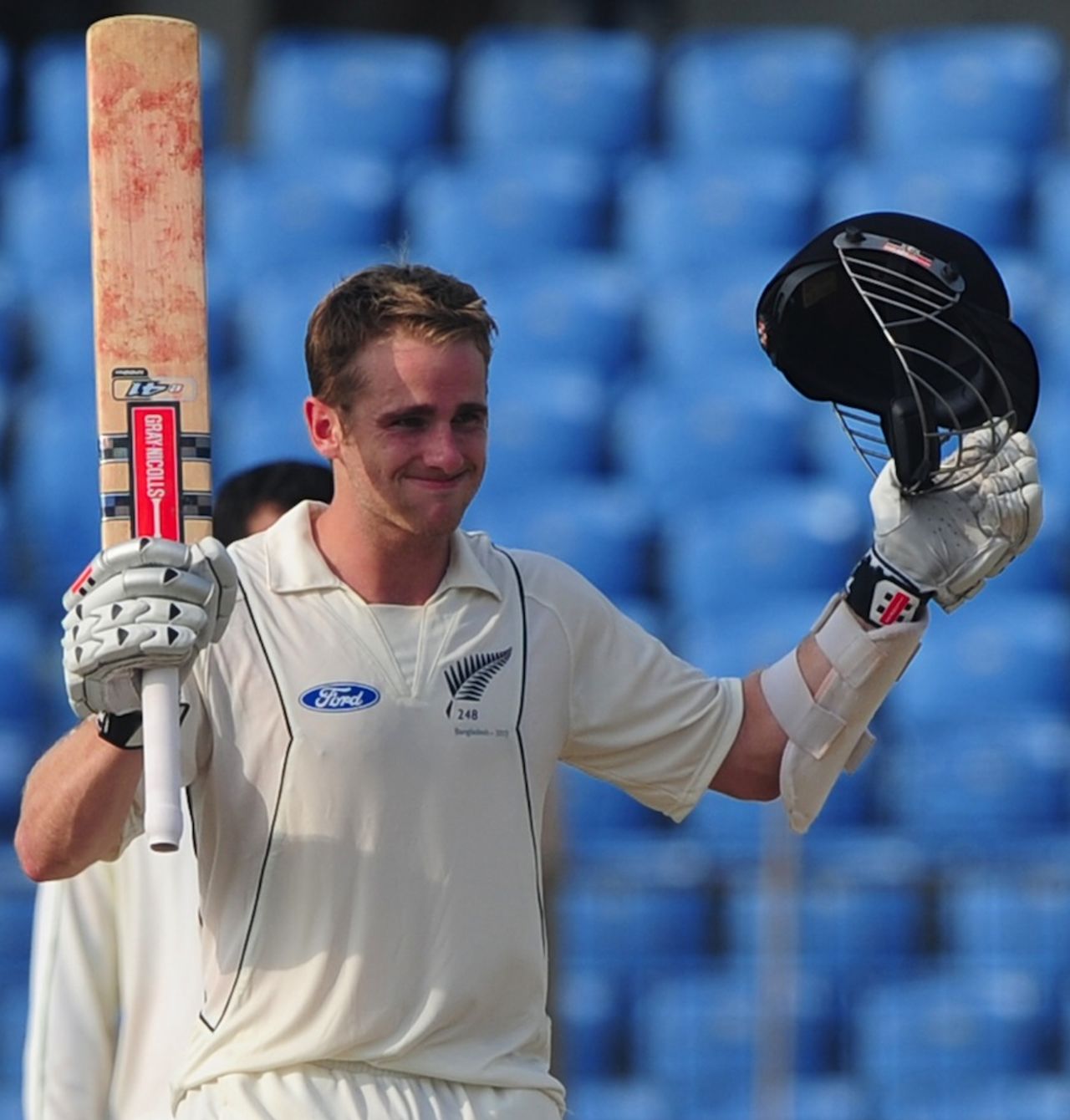Kane Williamson raises his bat after hitting his fourth Test century, Bangladesh v New Zealand, 1st Test, Chittagong, day 1, October 9, 2013