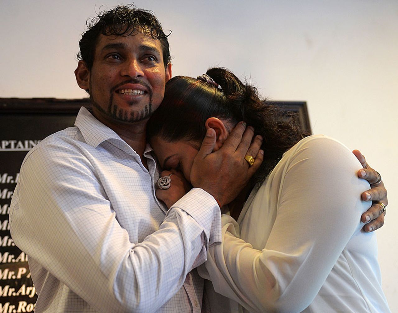 Tillakaratne Dilshan consoles his wife after she broke down during his Test retirement announcement, Colombo, October 10, 2013