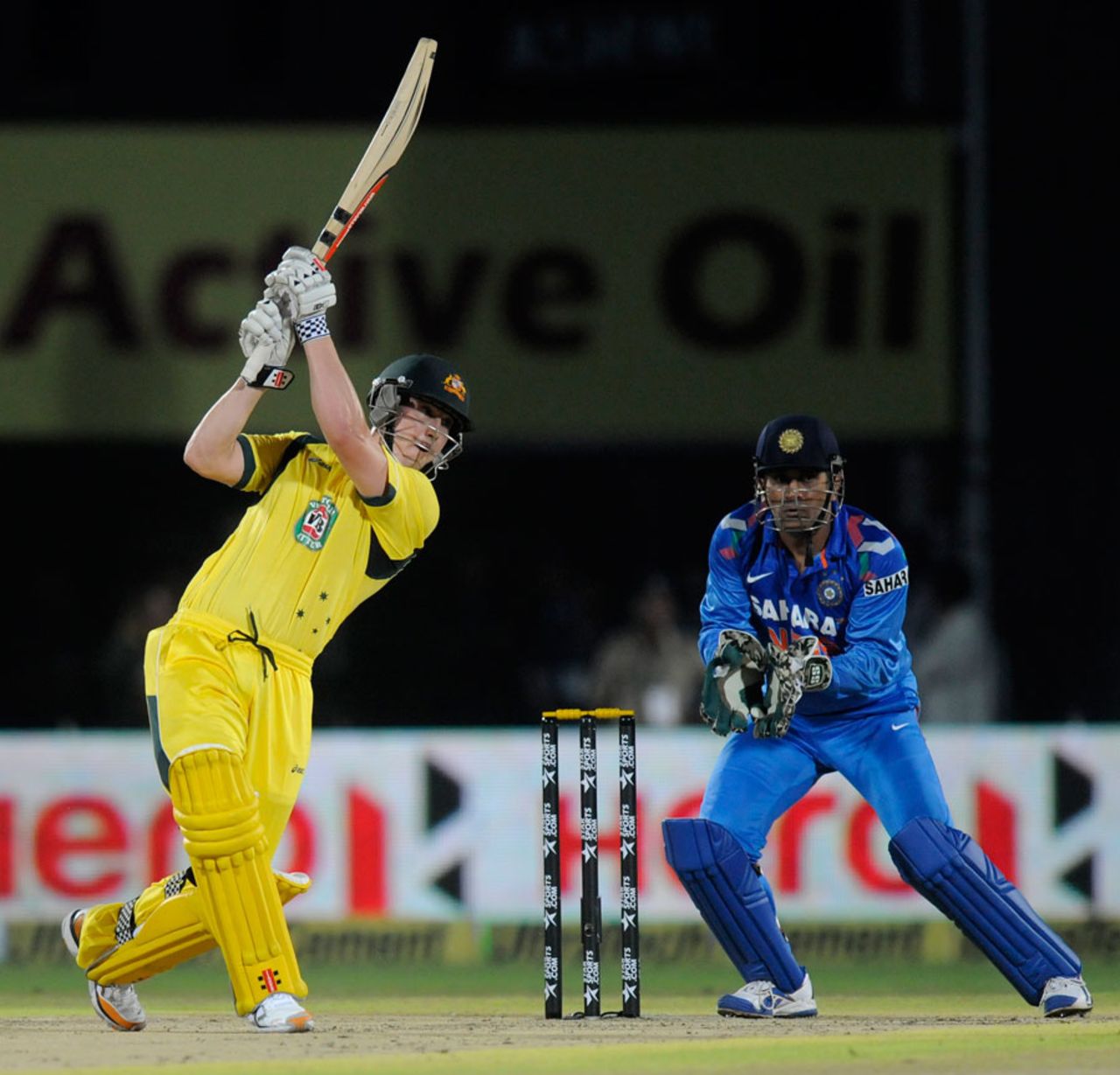 Nic Maddinson lofts over the off side, India v Australia, one-off T20, Rajkot, October 10, 2013